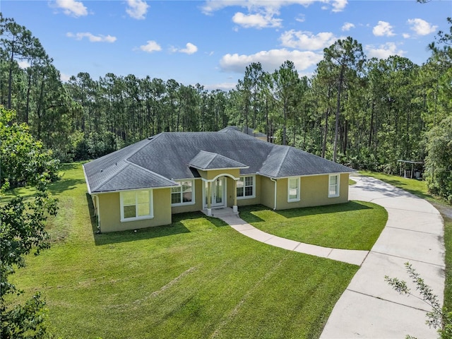 859 Leather Fern Ln, Mims, FL 32754 - single story home featuring driveway, stucco siding, a front lawn, and a wooded view