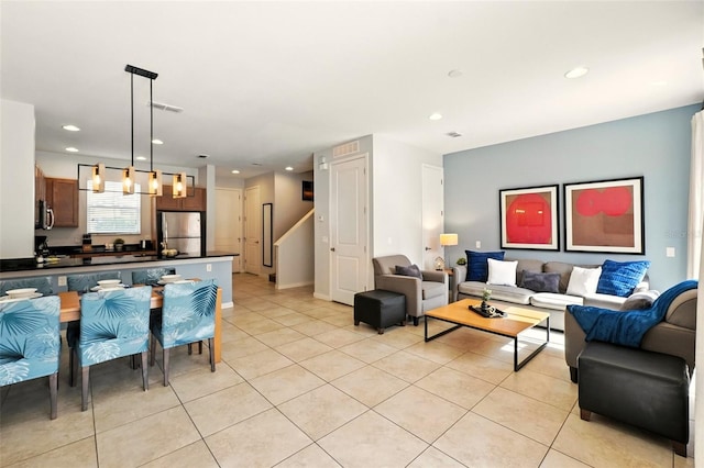 2617 Bugatti Ct, Kissimmee, FL 34746 - living room with light tile patterned floors and recessed lighting