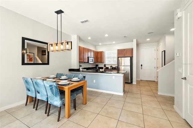 2617 Bugatti Ct, Kissimmee, FL 34746 - dining room with light tile patterned floors, recessed lighting, and a chandelier