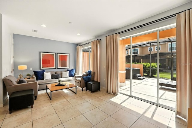 2617 Bugatti Ct, Kissimmee, FL 34746 - living room featuring light tile patterned floors and recessed lighting