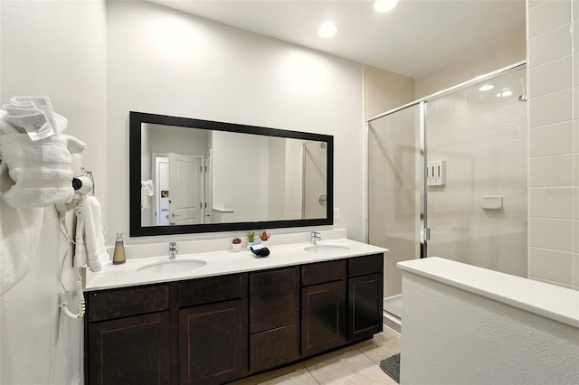 2617 Bugatti Ct, Kissimmee, FL 34746 - full bathroom with a stall shower, double vanity, tile patterned floors, and recessed lighting