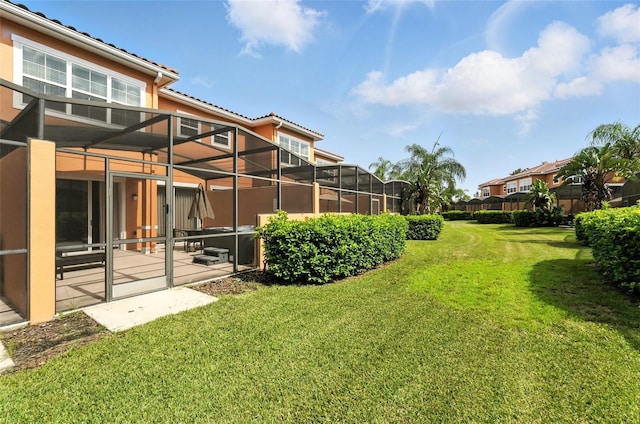 2617 Bugatti Ct, Kissimmee, FL 34746 - view of green lawn featuring glass enclosure and a patio area