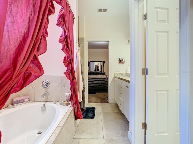 2218 W Gore St, Orlando, FL 32805 - ensuite bathroom featuring a bath, vanity, and tile patterned floors