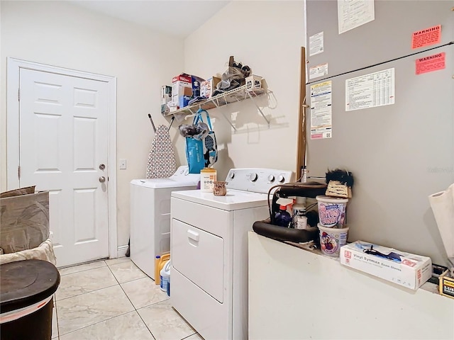 2218 W Gore St, Orlando, FL 32805 - laundry area with washer and dryer, heating unit, and light tile patterned floors