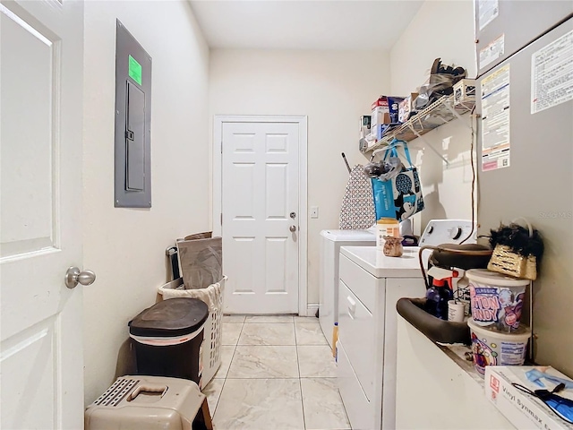 2218 W Gore St, Orlando, FL 32805 - laundry area featuring washer and clothes dryer, electric panel, and light marble finish floors