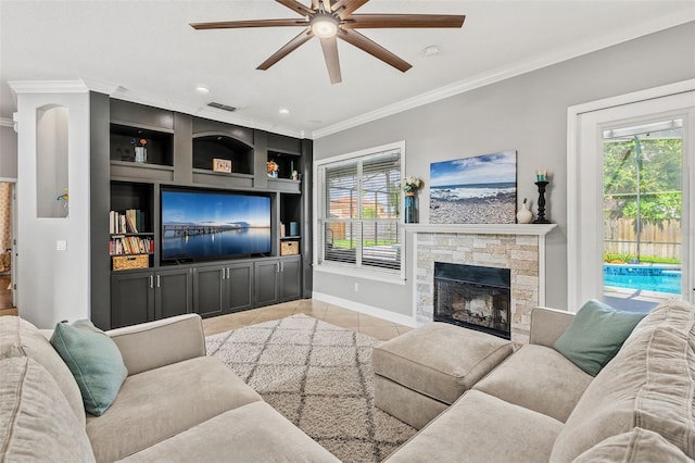 4323 Kezar Ct, Belle Isle, FL 32812 - living area with ceiling fan, ornamental molding, light tile patterned floors, a fireplace, and built in shelves