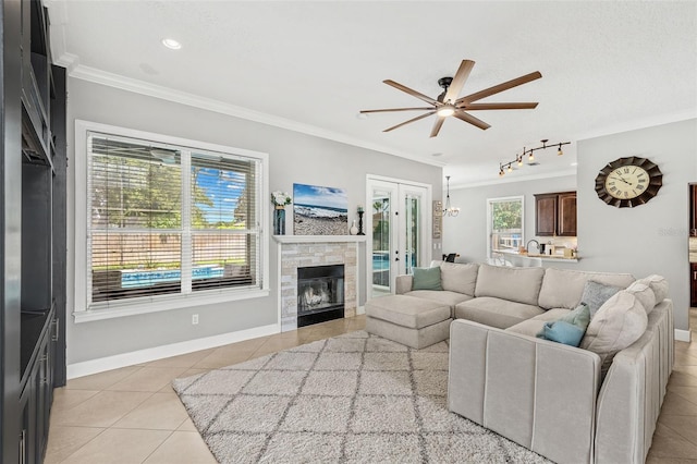 4323 Kezar Ct, Belle Isle, FL 32812 - living room featuring crown molding, light tile patterned floors, a ceiling fan, and french doors