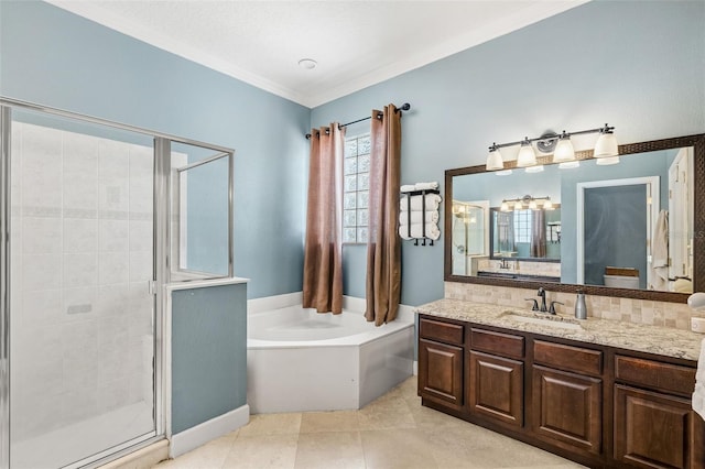 4323 Kezar Ct, Belle Isle, FL 32812 - bathroom with a stall shower, a garden tub, vanity, tile patterned floors, and ornamental molding