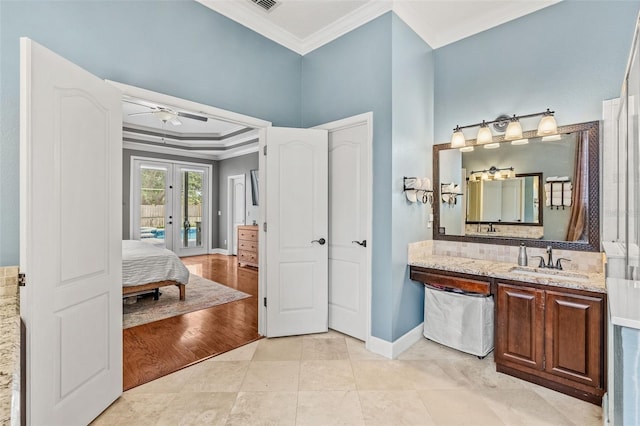 4323 Kezar Ct, Belle Isle, FL 32812 - full bathroom featuring ornamental molding, french doors, connected bathroom, vanity, and ceiling fan