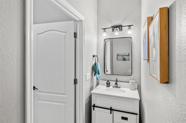 4323 Kezar Ct, Belle Isle, FL 32812 - bathroom with vanity and a textured wall