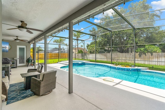 4323 Kezar Ct, Belle Isle, FL 32812 - view of swimming pool with a fenced backyard, a patio, glass enclosure, ceiling fan, and a pool with connected hot tub