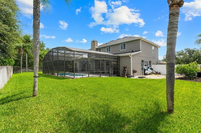 4323 Kezar Ct, Belle Isle, FL 32812 - rear view of house featuring a fenced backyard, stucco siding, a lanai, and a chimney