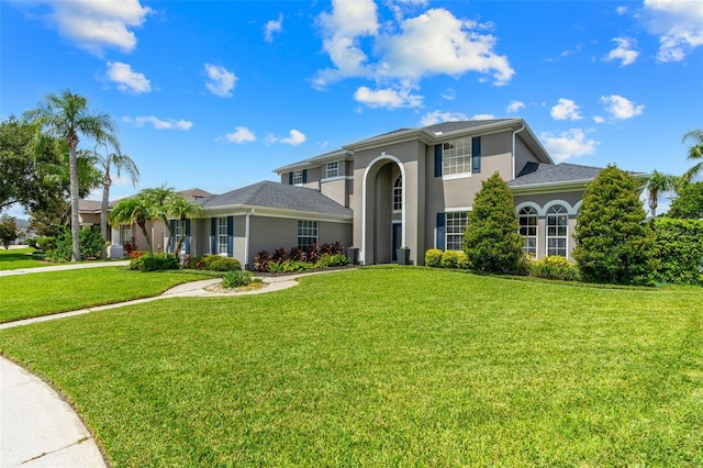 4323 Kezar Ct, Belle Isle, FL 32812 - view of front facade featuring stucco siding and a front lawn