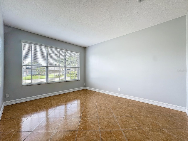 229 Largovista Dr, Oakland, FL 34787 - empty room featuring a textured ceiling and tile patterned floors