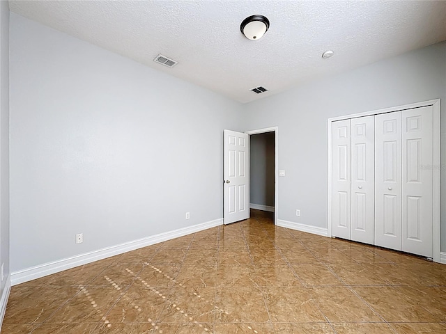229 Largovista Dr, Oakland, FL 34787 - unfurnished bedroom with a textured ceiling and a closet