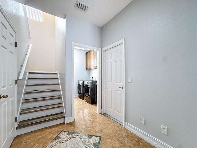 229 Largovista Dr, Oakland, FL 34787 - stairs featuring separate washer and dryer and tile patterned floors