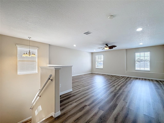 229 Largovista Dr, Oakland, FL 34787 - empty room with a textured ceiling, recessed lighting, a smoke detector, dark wood finished floors, and healthy amount of natural light