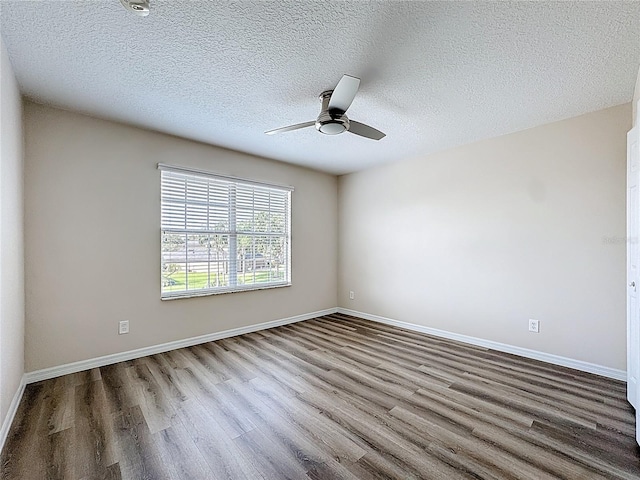 229 Largovista Dr, Oakland, FL 34787 - spare room with wood finished floors, ceiling fan, and a textured ceiling
