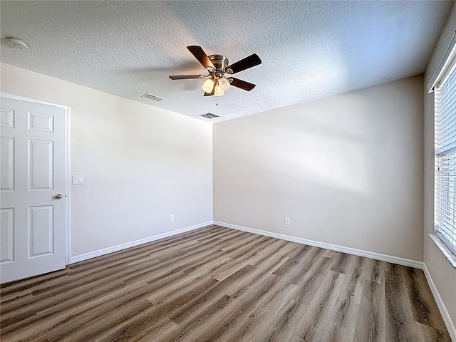 229 Largovista Dr, Oakland, FL 34787 - empty room featuring wood finished floors, a textured ceiling, a ceiling fan, and a smoke detector