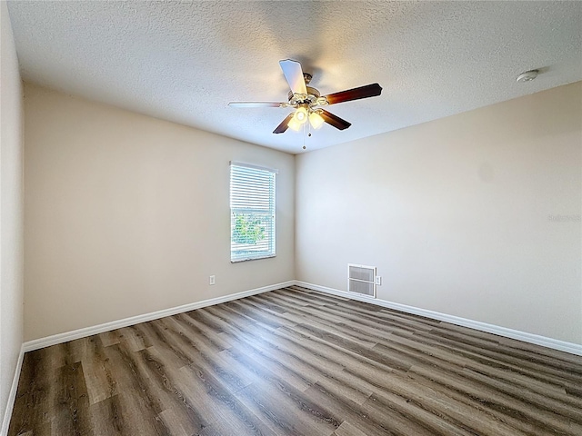 229 Largovista Dr, Oakland, FL 34787 - empty room featuring a smoke detector, wood finished floors, a ceiling fan, and a textured ceiling