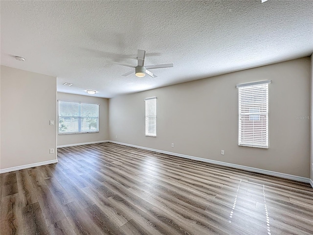 229 Largovista Dr, Oakland, FL 34787 - empty room featuring ceiling fan, wood finished floors, and a textured ceiling