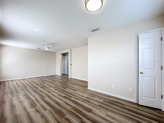229 Largovista Dr, Oakland, FL 34787 - spare room with wood finished floors, ceiling fan, and a textured ceiling