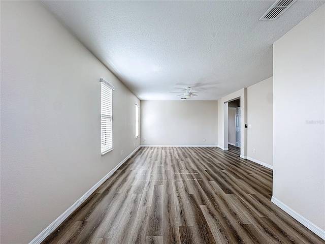 229 Largovista Dr, Oakland, FL 34787 - empty room with wood finished floors, ceiling fan, and a textured ceiling