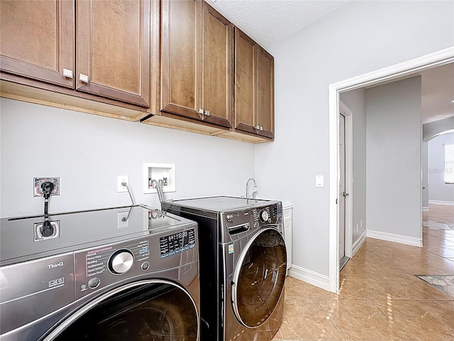 229 Largovista Dr, Oakland, FL 34787 - laundry room with cabinet space, washing machine and clothes dryer, and arched walkways