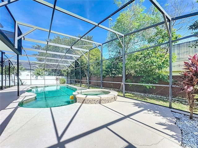 229 Largovista Dr, Oakland, FL 34787 - view of pool featuring a pool with connected hot tub, a fenced backyard, a patio, and glass enclosure