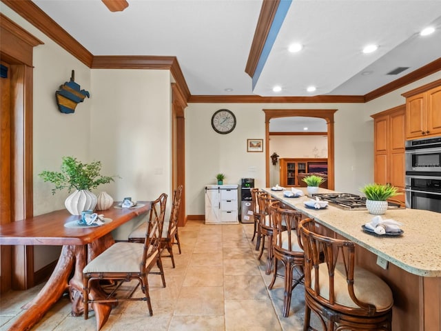 9045 Mossy Oak Ln, Clermont, FL 34711 - dining space featuring crown molding, recessed lighting, and light tile patterned flooring
