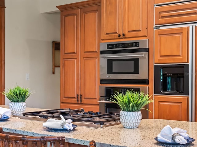 9045 Mossy Oak Ln, Clermont, FL 34711 - kitchen with stainless steel appliances and light stone counters