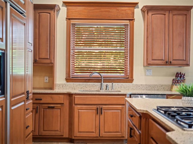 9045 Mossy Oak Ln, Clermont, FL 34711 - kitchen with stainless steel gas cooktop, light stone countertops, and brown cabinets
