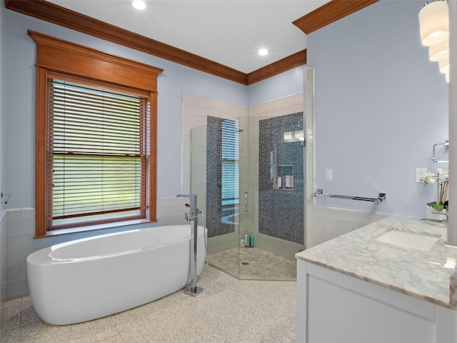 9045 Mossy Oak Ln, Clermont, FL 34711 - full bath featuring tile walls, a soaking tub, a stall shower, vanity, and ornamental molding
