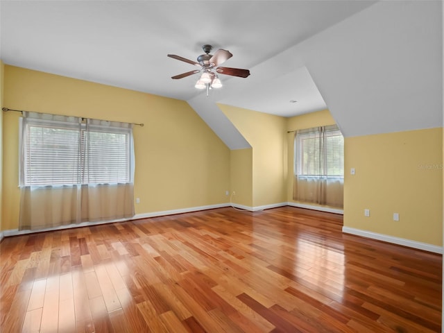 9045 Mossy Oak Ln, Clermont, FL 34711 - additional living space with wood finished floors, a ceiling fan, and vaulted ceiling