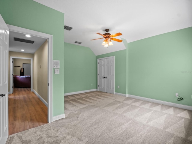 9045 Mossy Oak Ln, Clermont, FL 34711 - carpeted empty room featuring ceiling fan and vaulted ceiling