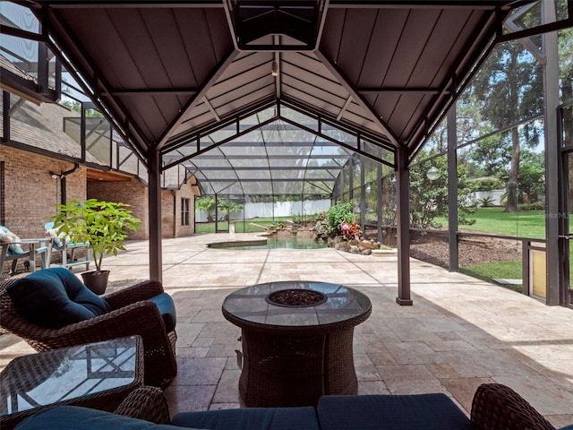 9045 Mossy Oak Ln, Clermont, FL 34711 - view of patio / terrace featuring glass enclosure, an outdoor pool, and an outdoor fire pit