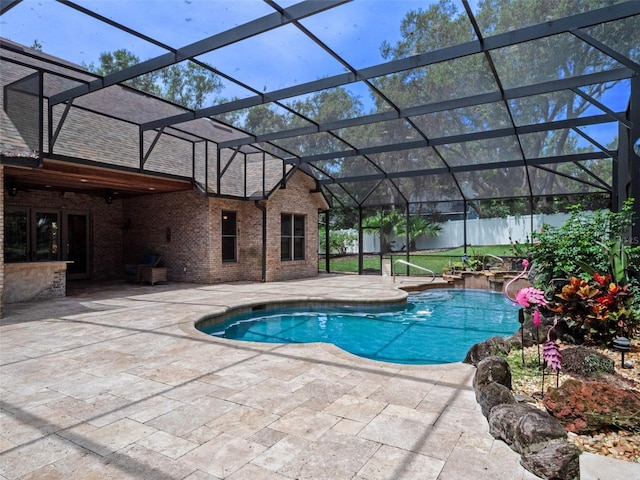 9045 Mossy Oak Ln, Clermont, FL 34711 - outdoor pool with a patio, a fenced backyard, and glass enclosure