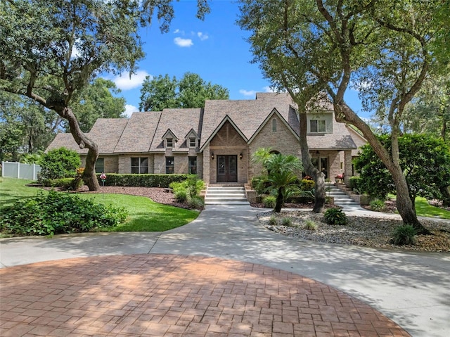 9045 Mossy Oak Ln, Clermont, FL 34711 - english style home with french doors and stone siding