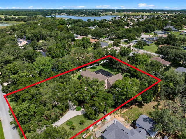 9045 Mossy Oak Ln, Clermont, FL 34711 - aerial view of residential area featuring a nearby body of water and property boundaries highlighted