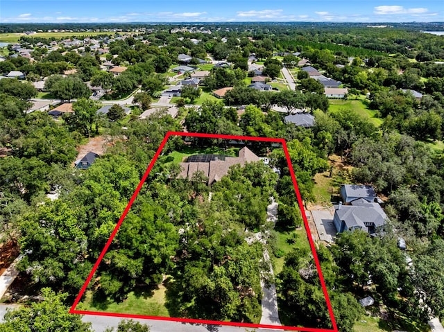 9045 Mossy Oak Ln, Clermont, FL 34711 - aerial perspective of suburban area featuring property parcel outlined
