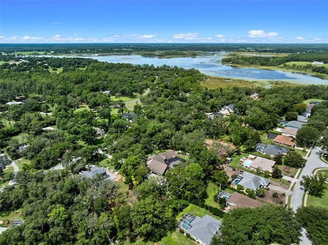 9045 Mossy Oak Ln, Clermont, FL 34711 - aerial view of property and surrounding area with a large body of water and nearby suburban area