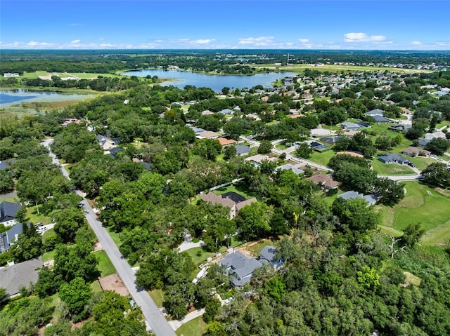 9045 Mossy Oak Ln, Clermont, FL 34711 - aerial view of property and surrounding area featuring a large body of water and nearby suburban area