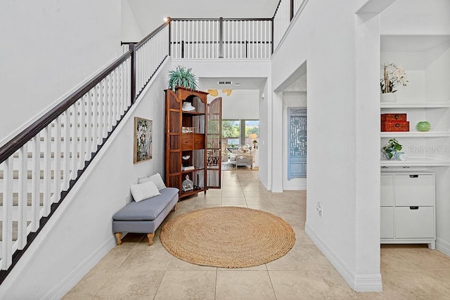 14897 Ellingsworth Ln, Winter Garden, FL 34787 - tiled entrance foyer with stairway and a towering ceiling