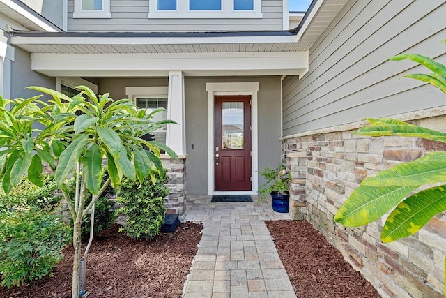 14897 Ellingsworth Ln, Winter Garden, FL 34787 - doorway to property featuring stucco siding