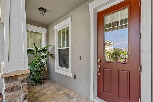 14897 Ellingsworth Ln, Winter Garden, FL 34787 - entrance to property featuring stucco siding