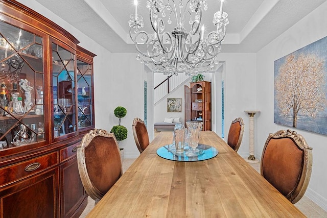 14897 Ellingsworth Ln, Winter Garden, FL 34787 - dining space featuring a chandelier and a raised ceiling