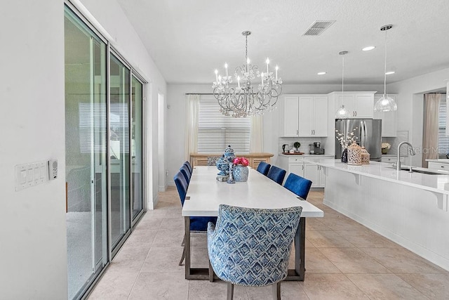 14897 Ellingsworth Ln, Winter Garden, FL 34787 - dining room with a chandelier, recessed lighting, and light tile patterned floors