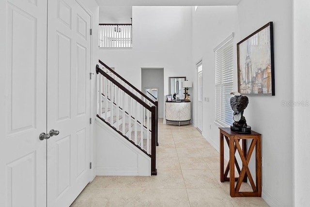 14897 Ellingsworth Ln, Winter Garden, FL 34787 - foyer entrance featuring stairs, light tile patterned floors, and a high ceiling