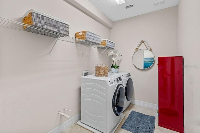 14897 Ellingsworth Ln, Winter Garden, FL 34787 - washroom featuring washing machine and dryer and baseboards