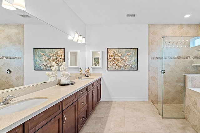 14897 Ellingsworth Ln, Winter Garden, FL 34787 - bathroom with double vanity, a walk in shower, and tile patterned flooring